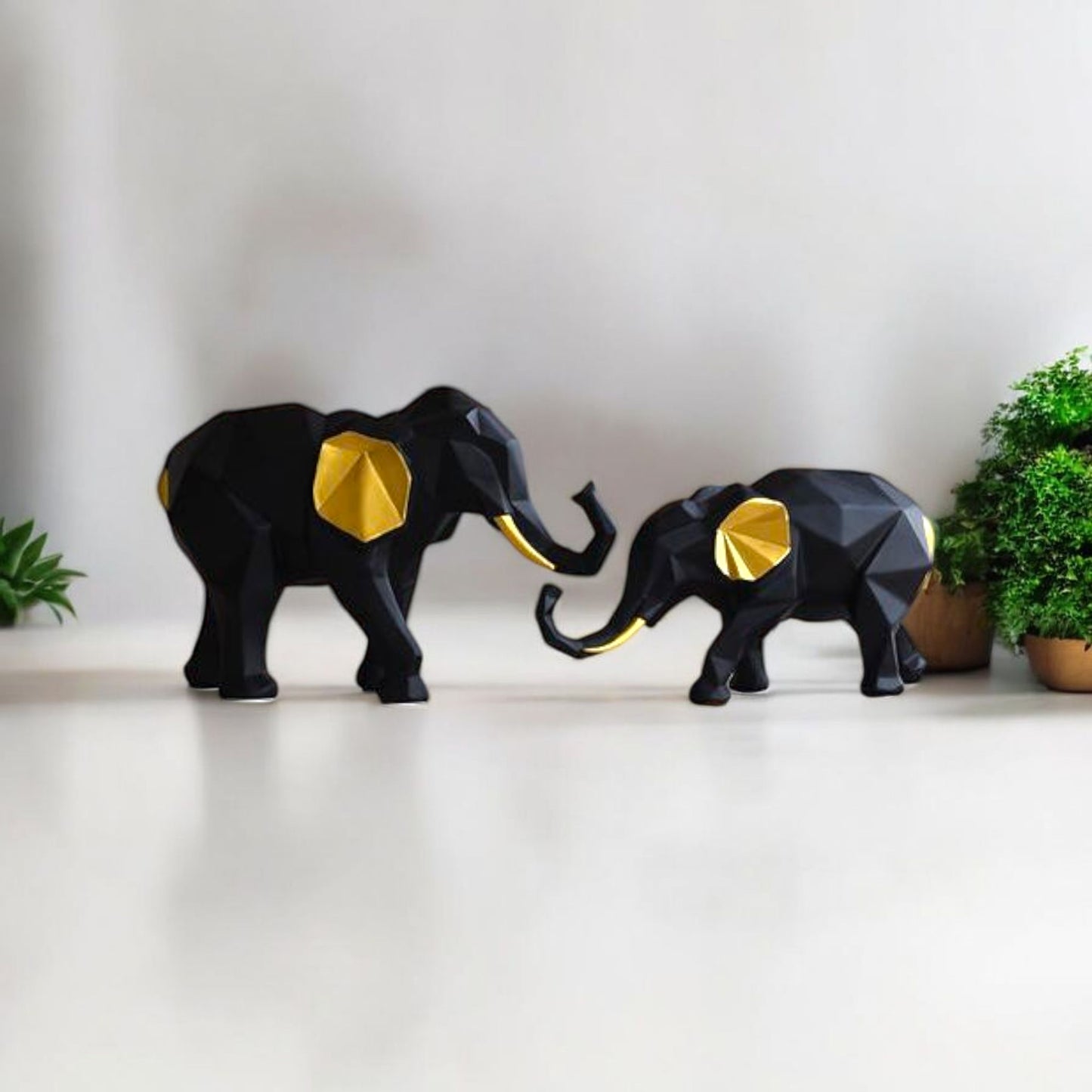 Black and Gold Elephant Figurines