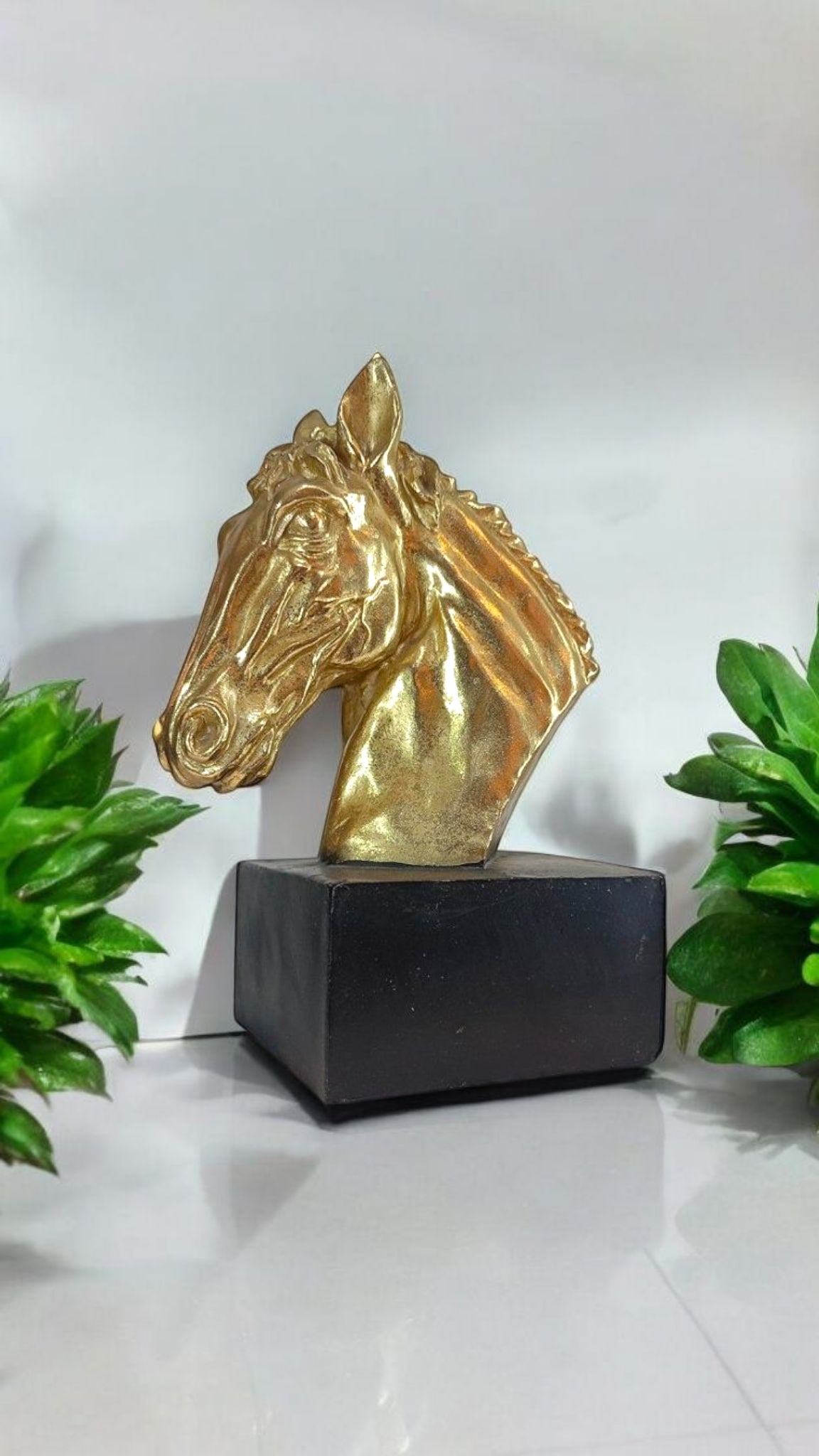 Elegant Golden Horse Head Sculpture on Black Base